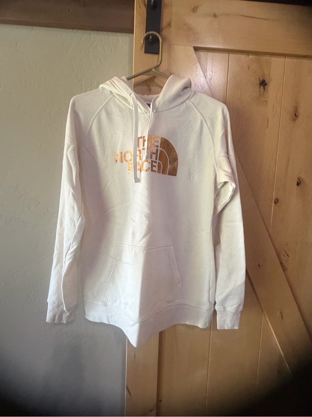 The North Face Cream Hoodie with Gold Logo